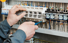 Electrician fitting a fuse box